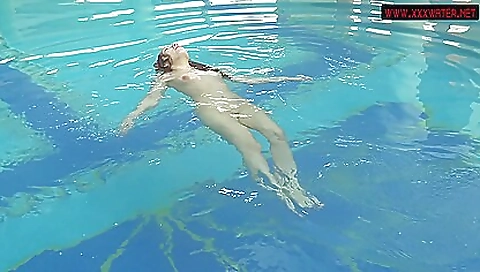 Beautiful babes with sexy bodies in a pool at the beach