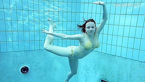 Beautiful brunette with sexy boobs in a hot bikini