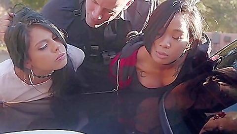 Ebony chicks with tattoos are in a hot outdoor threesome