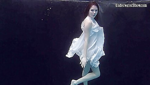 Busty brunette beauty in sexy lingerie in the bathroom