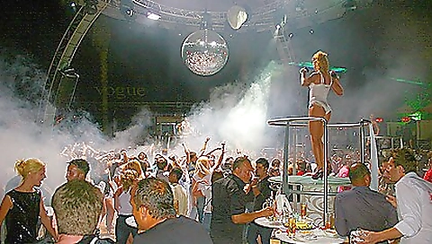 Brunette in high heels with a sexy taut body on plane