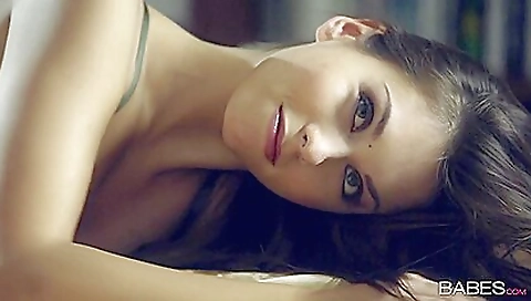 Brunette in her sexy dress enjoys solo sex with her lover