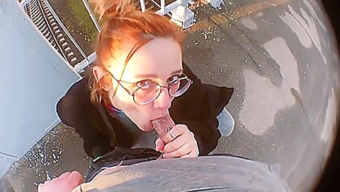 Redhead babe with a tattooed pussy is on the streets